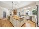 Gourmet kitchen boasting a large island, granite counters, and ample cabinet space at 5302 E Mercer Ln, Scottsdale, AZ 85254