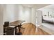 Home office with built-in desk and hardwood floors at 5302 E Mercer Ln, Scottsdale, AZ 85254