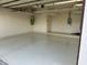 Garage with overhead storage and epoxy floor at 5302 E Mercer Ln, Scottsdale, AZ 85254
