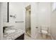 Bathroom with granite vanity and a walk-in shower at 5302 E Mercer Ln, Scottsdale, AZ 85254