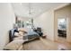 Spacious bedroom with a large bed and access to office at 5302 E Mercer Ln, Scottsdale, AZ 85254
