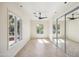 Bright bedroom with mirrored closet doors and hardwood floors at 5302 E Mercer Ln, Scottsdale, AZ 85254