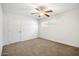 Bright bedroom with ceiling fan and neutral carpeting at 845 W Edgemont Ave, Phoenix, AZ 85007