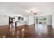 Open concept living space with hardwood floors, kitchen, and golf course view at 845 W Edgemont Ave, Phoenix, AZ 85007