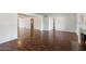 Spacious living area featuring hardwood floors and views into adjacent rooms at 845 W Edgemont Ave, Phoenix, AZ 85007