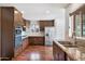 Updated kitchen, featuring dark wood cabinets and granite countertops at 845 W Edgemont Ave, Phoenix, AZ 85007