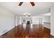 Open living area with hardwood floors, kitchen, and fireplace at 845 W Edgemont Ave, Phoenix, AZ 85007
