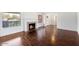 Bright living room with hardwood floors, fireplace, and large windows at 845 W Edgemont Ave, Phoenix, AZ 85007