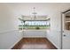 Bright dining room with wainscoting and a view at 845 W Edgemont Ave, Phoenix, AZ 85007