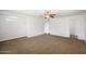 Spacious bedroom with ceiling fan and neutral carpeting at 845 W Edgemont Ave, Phoenix, AZ 85007