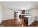 Modern kitchen with dark wood cabinets and granite countertops at 845 W Edgemont Ave, Phoenix, AZ 85007