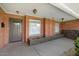 Brick entryway with gray door and planter boxes at 845 W Edgemont Ave, Phoenix, AZ 85007