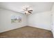 Bedroom with ceiling fan, window blinds, and neutral carpet at 845 W Edgemont Ave, Phoenix, AZ 85007