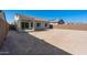 Large backyard with neutral landscaping and covered patio at 2869 N Coronado Dr, Florence, AZ 85132