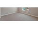 Spacious bedroom with neutral carpet and large window at 2869 N Coronado Dr, Florence, AZ 85132