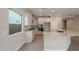Modern kitchen with island, stainless steel appliances, and granite countertops at 2869 N Coronado Dr, Florence, AZ 85132