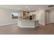 Modern kitchen with island, stainless steel appliances, and granite countertops at 2869 N Coronado Dr, Florence, AZ 85132