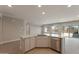 Open concept living area with kitchen and access to backyard at 2869 N Coronado Dr, Florence, AZ 85132
