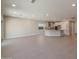 Open living space with tile floors and kitchen views at 2869 N Coronado Dr, Florence, AZ 85132