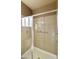 Walk-in shower with glass enclosure and tiled walls at 9833 E Gemini Pl, Sun Lakes, AZ 85248
