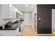 Modern kitchenette with white cabinets, stainless steel appliances, and granite countertop at 1708 E Verde Ln, Phoenix, AZ 85016