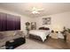 Comfortable bedroom with a bed, sofa, and ceiling fan at 17025 E La Montana Dr # 107, Fountain Hills, AZ 85268