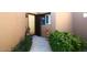 Private front door entrance with a small fountain and landscaping at 17025 E La Montana Dr # 107, Fountain Hills, AZ 85268