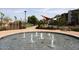 Circular fountain with multiple water jets in community area at 17025 E La Montana Dr # 107, Fountain Hills, AZ 85268