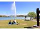 Gathering enjoying lake view with large fountain in background at 17025 E La Montana Dr # 107, Fountain Hills, AZ 85268