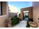Inviting entryway with decorative gate and lush landscaping at 17025 E La Montana Dr # 107, Fountain Hills, AZ 85268