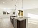 Kitchen island with granite countertop and stainless steel dishwasher at 4651 N 177Th Ln, Goodyear, AZ 85395