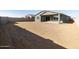 Backyard view of house and grassy area at 4657 N 177Th Ln, Goodyear, AZ 85395
