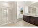 Bathroom boasts double vanity, soaking tub, and shower at 4657 N 177Th Ln, Goodyear, AZ 85395