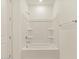 Bathroom with shower/tub combo and built in shelving at 4657 N 177Th Ln, Goodyear, AZ 85395