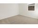 Simple carpeted bedroom with a window at 4657 N 177Th Ln, Goodyear, AZ 85395