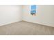 Bright bedroom with neutral carpeting and a window at 4657 N 177Th Ln, Goodyear, AZ 85395