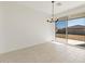 Bright dining area with tile flooring and sliding glass doors to backyard at 4657 N 177Th Ln, Goodyear, AZ 85395
