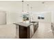 Modern kitchen with island, stainless steel appliances, and granite countertops at 4657 N 177Th Ln, Goodyear, AZ 85395