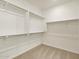 Large walk-in closet with double hanging rods at 4657 N 177Th Ln, Goodyear, AZ 85395