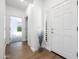 Bright entryway with wood-look flooring and built-in shelving at 41333 N Belfair Way, Anthem, AZ 85086