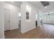 Hallway with light walls, wood-look floors, and built-in niches at 41333 N Belfair Way, Anthem, AZ 85086