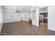 Spacious living room with hardwood floors and kitchen access at 41333 N Belfair Way, Anthem, AZ 85086