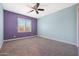 Charming bedroom with light walls, ceiling fan, and window shutters at 41333 N Belfair Way, Anthem, AZ 85086