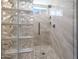 Spacious shower with glass block feature and modern tile at 41333 N Belfair Way, Anthem, AZ 85086