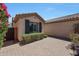 Courtyard entry with brick pavers and a gated side yard at 41333 N Belfair Way, Anthem, AZ 85086