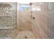 Large shower with glass block feature and modern tile at 41333 N Belfair Way, Anthem, AZ 85086