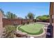 Backyard with putting green and brick pavers at 41333 N Belfair Way, Anthem, AZ 85086