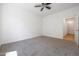 Bright and airy bedroom with ceiling fan and neutral carpeting at 41333 N Belfair Way, Anthem, AZ 85086