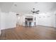 Bright living room featuring hardwood floors and kitchen island view at 41333 N Belfair Way, Anthem, AZ 85086