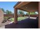 Backyard with putting green and covered patio at 41333 N Belfair Way, Anthem, AZ 85086